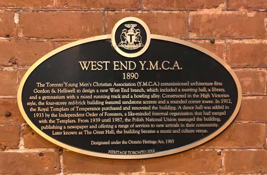 Oval bronze plaque with city of Toronto crest on top. The plaque reads: 
